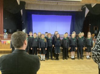 P5 sing Fr Conor's favourite hymn